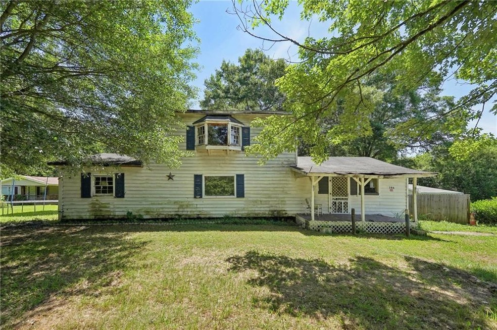 Split level home featuring a front lawn