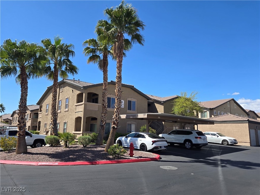 View of property with a residential view and cover