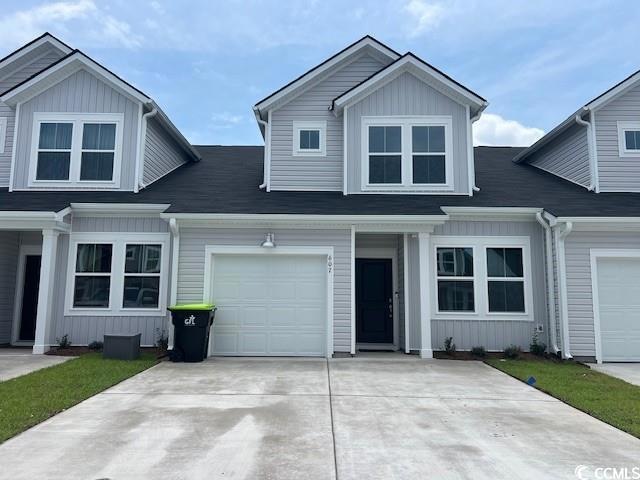 View of front of home featuring a garage