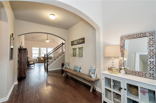 Step through the front door into this lovely foyer area with gleaming wood floors