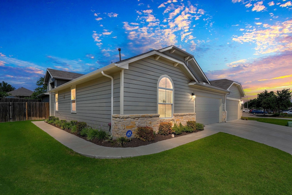 Property exterior at dusk featuring concrete driv