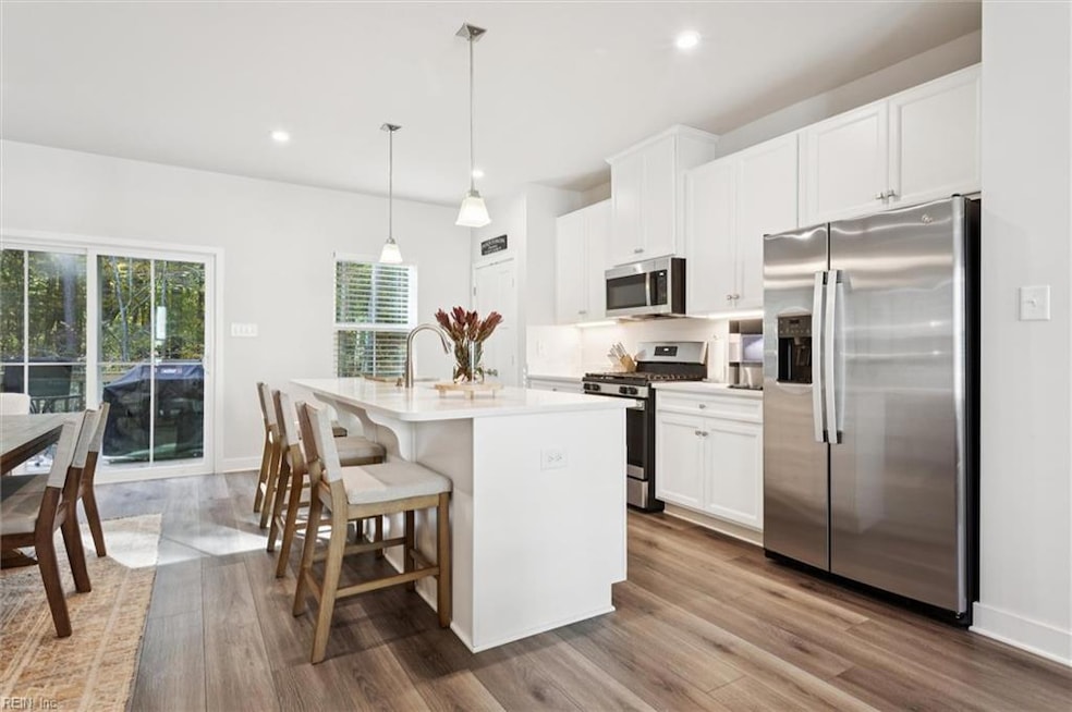 Open-concept kitchen with large island and granite countertops