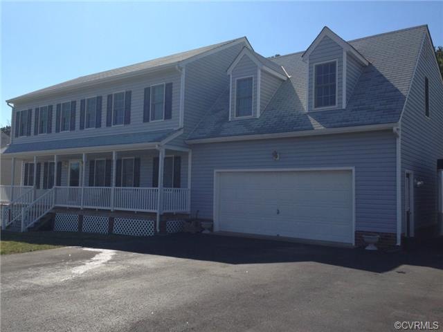 Beautiful full front porch, 2+ over sized garage. 