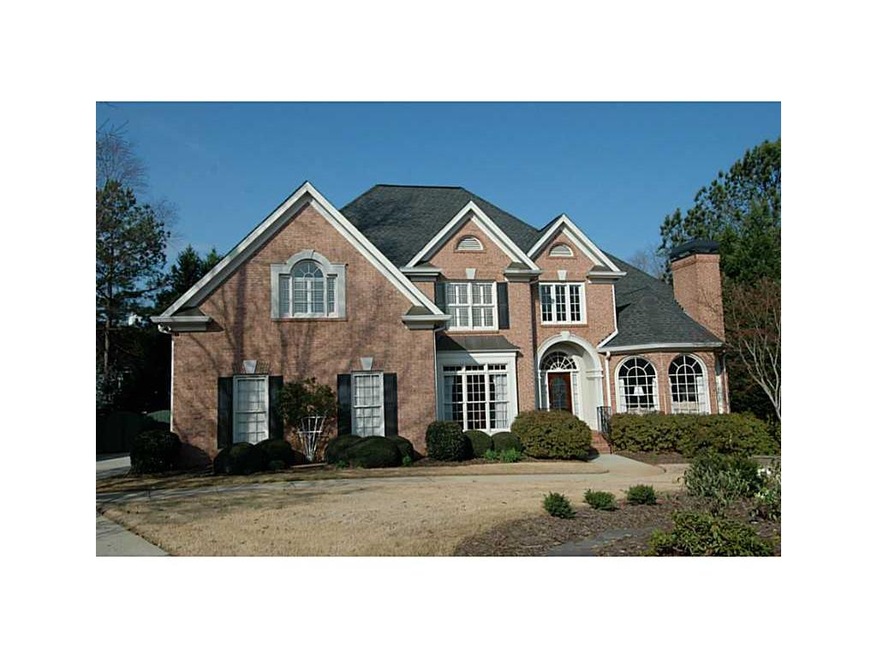 Exterior Front. Fabulous 3 sided brick home on cul