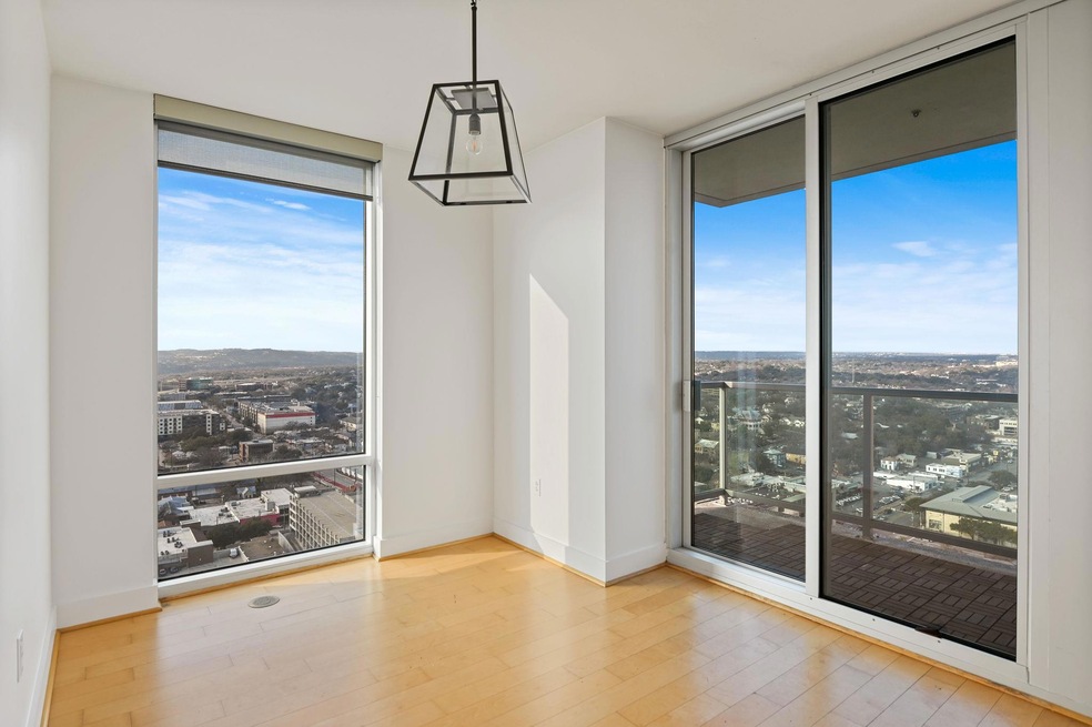 Empty room with a wall of windows, healthy amount