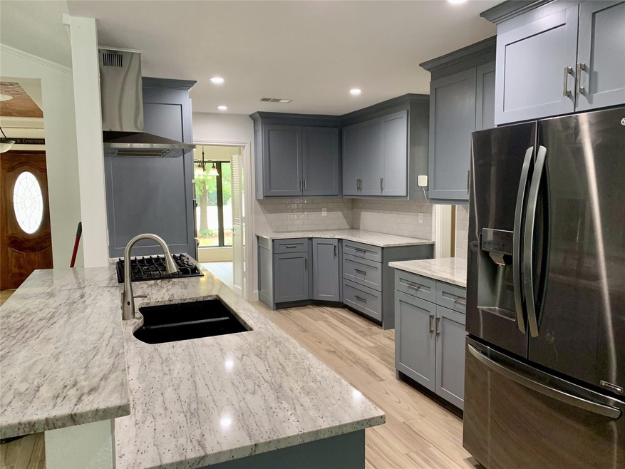 Kitchen with granite countertops.