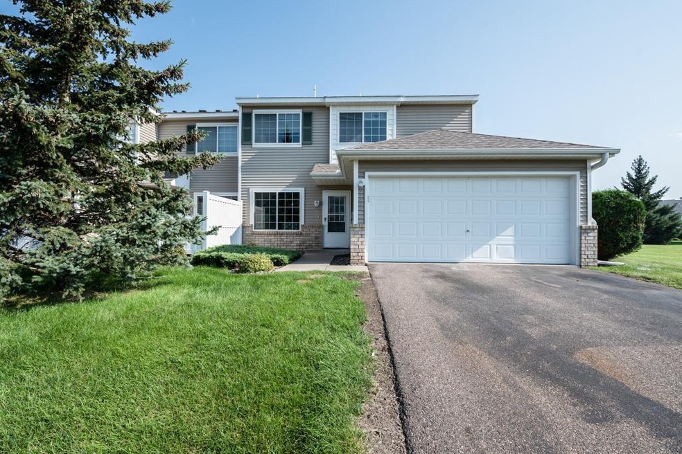 This delightful end-unit townhome is updated & mov