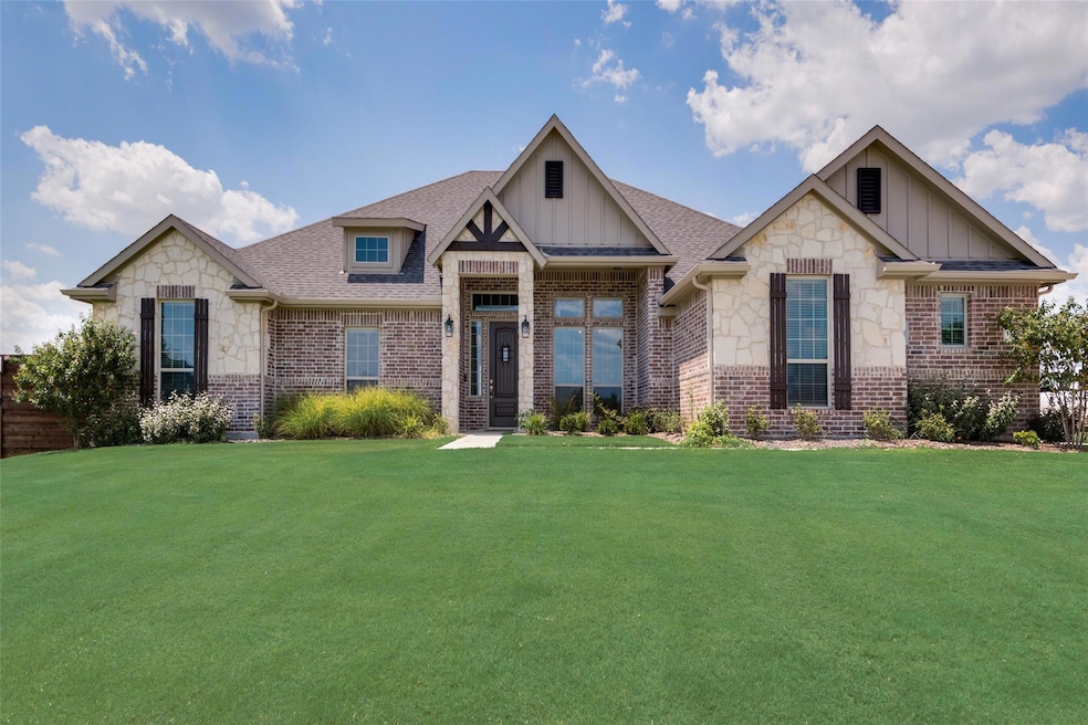 Craftsman-style home with a front yard