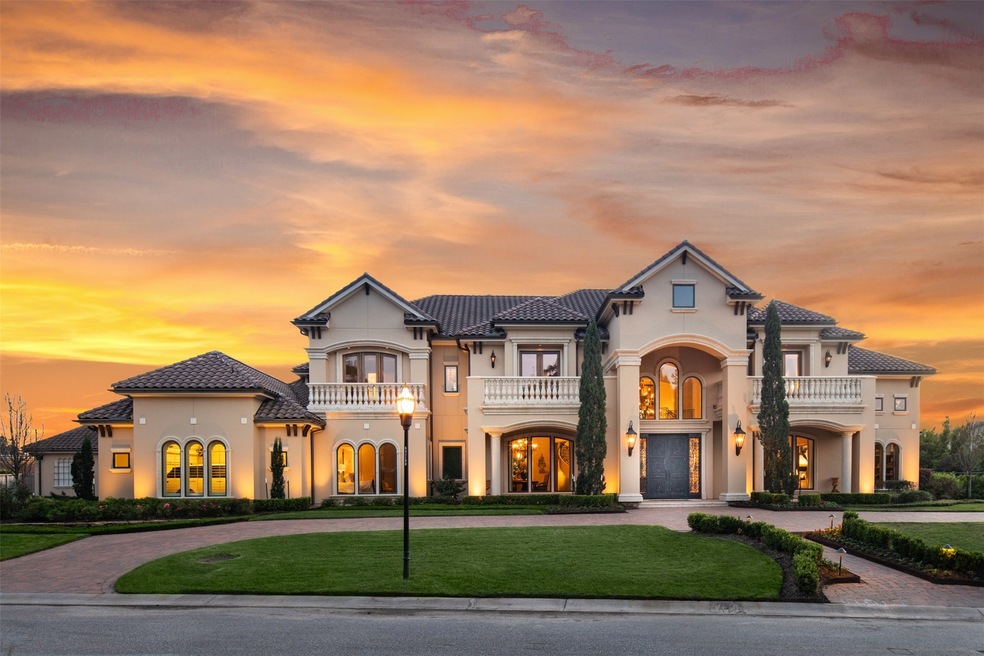 A grand circular driveway welcomes you home to this seven-bedroom Cypress showplace spanning a luxurious 10,583 square feet.
