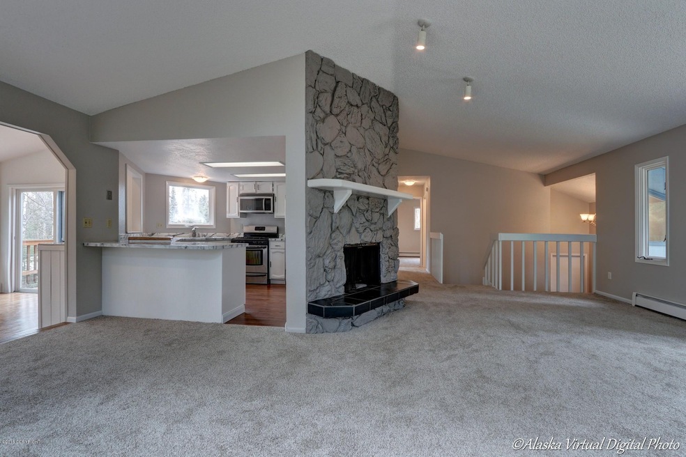 Open living room w/ vaulted ceilings!