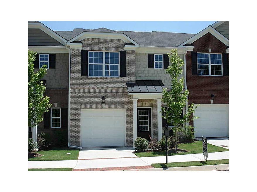 Facade/Exterior Front. Front elevation in brick, c