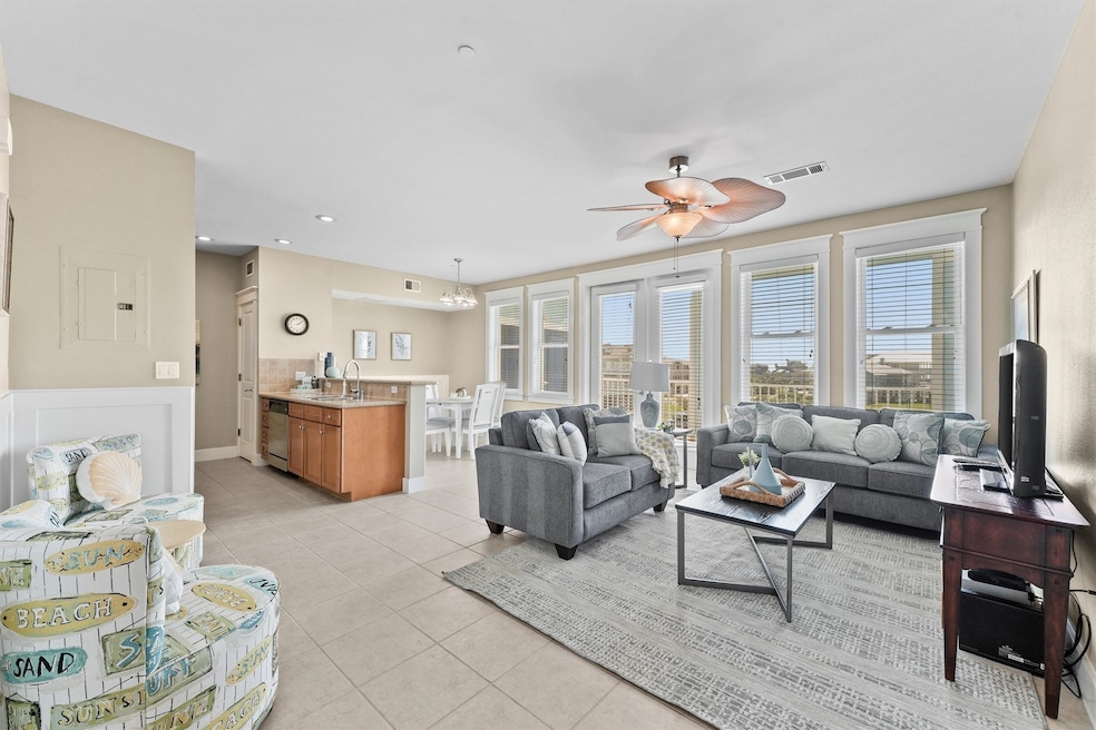 This spacious open-concept living area is bathed i