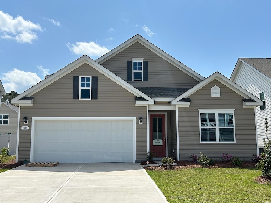 View of front of house featuring driveway and a fr