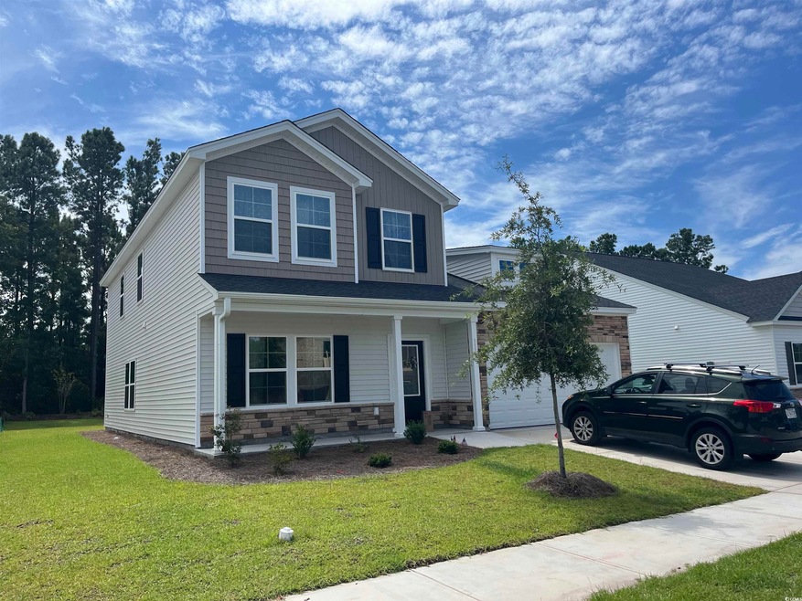 View of front of house featuring a garage, a front