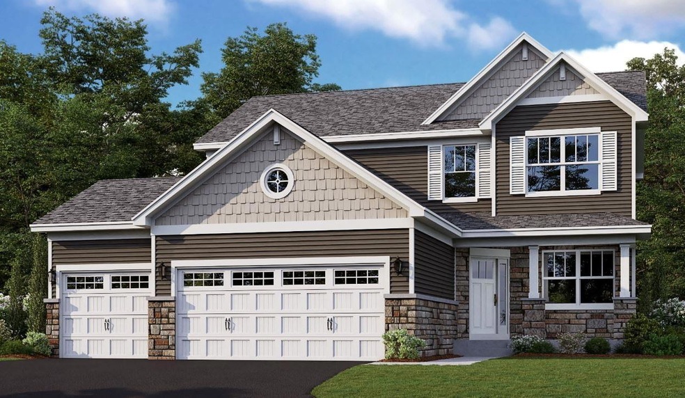 An unforgettable introduction to your home with stone accents, maintenance free finyl siding, beautiful front window grids, and a full 3-car garage big enough for all the toys.JPG