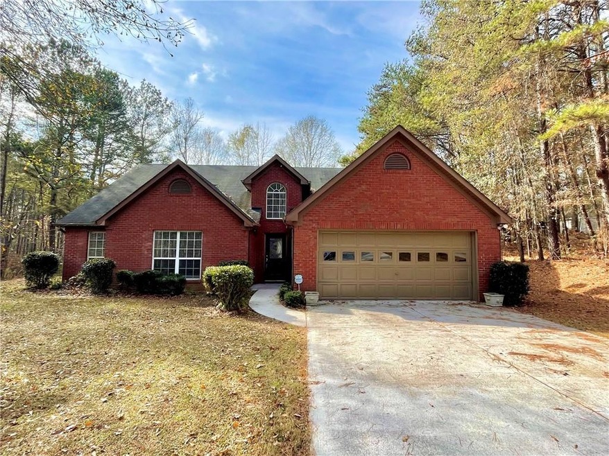 View of property with a garage