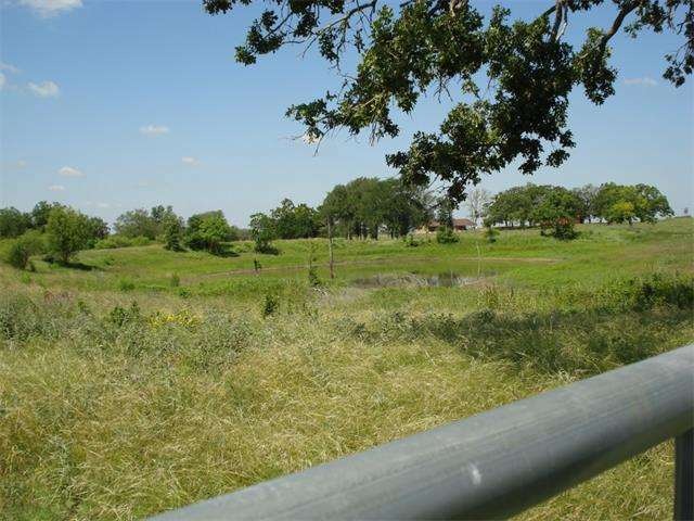 5.351 acres with large pond!  Many large oak trees