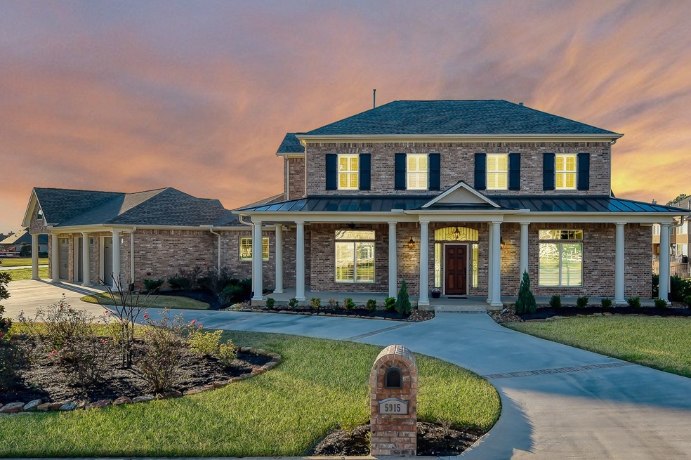 The 50' front porch overlooks the circular drive on a large corner lot.   White Oak Ranch is a gated subdivision on the eastern shores of Lake Conroe.