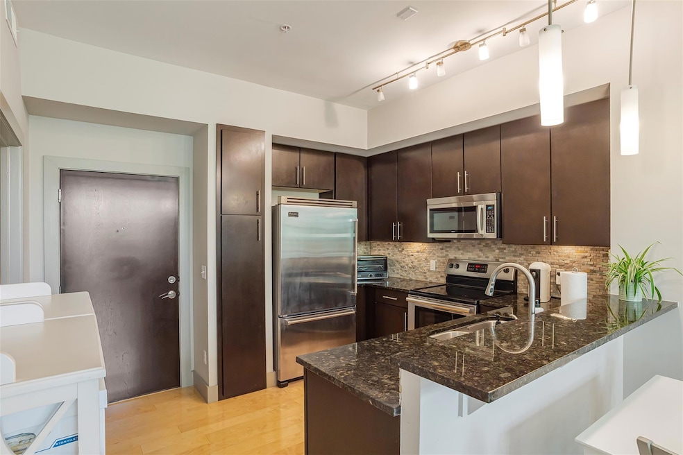 Kitchen featuring stainless steel appliances, a s