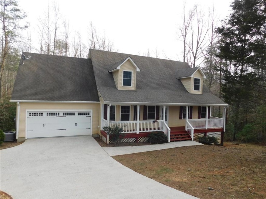 Cape cod home featuring central AC, covered porch,