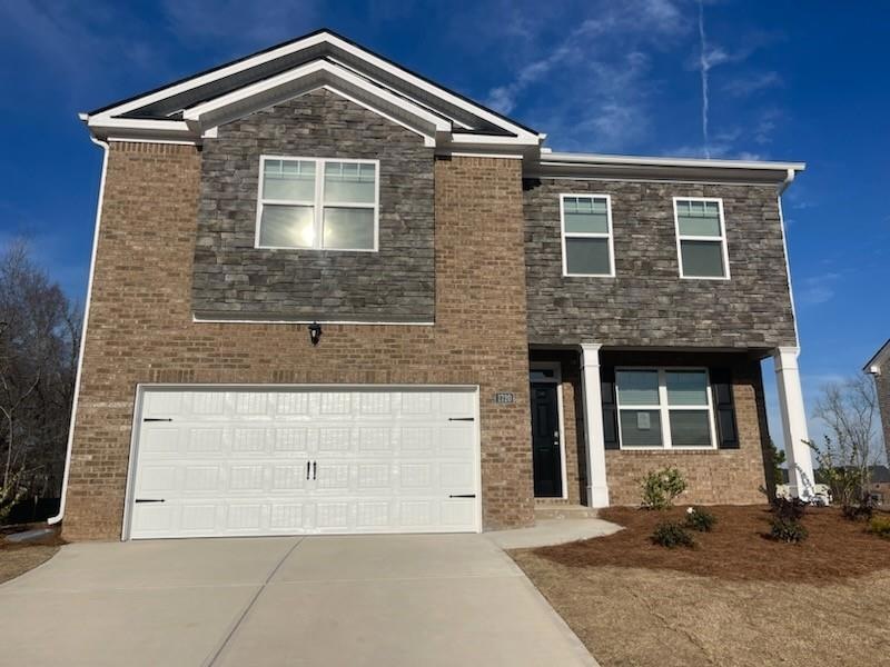 View of front of home featuring a garage