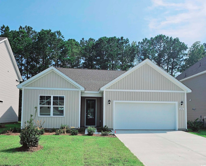 Single story home featuring a garage and a front l
