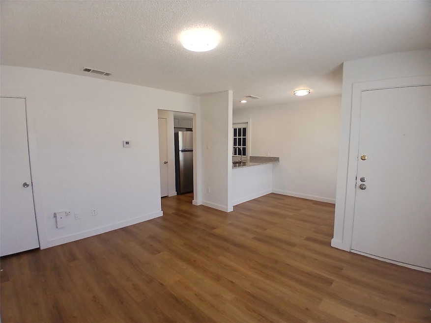 Unfurnished room featuring wood finished floors, 