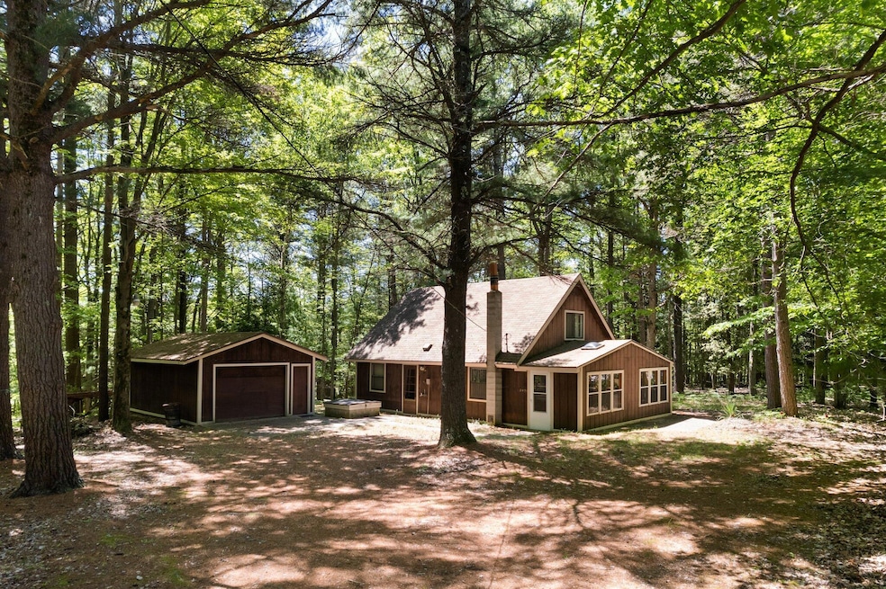Tucked into 2 wooded acres
