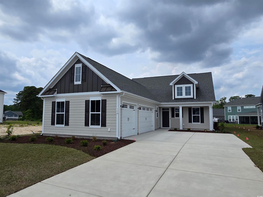 Modern inspired farmhouse with a front lawn, concr