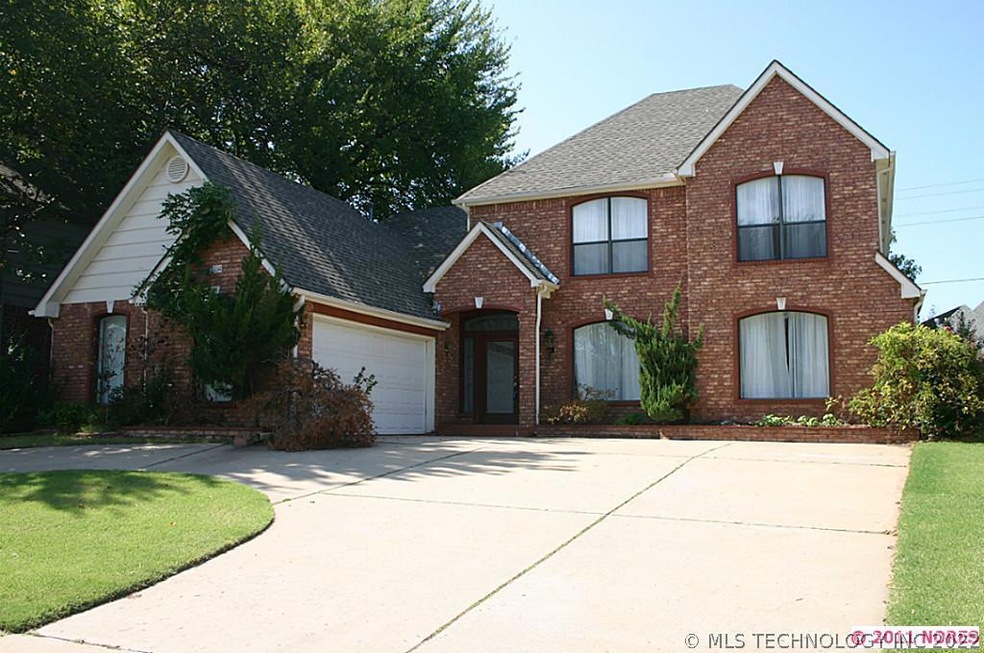 Circle driveway.  3-car wide garage inside