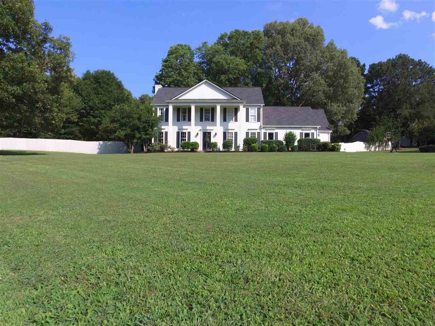 This Beautiful home sits on 2 acres. This Colonial