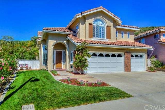 Beautifully landscaped Mediterranean charmer is ne