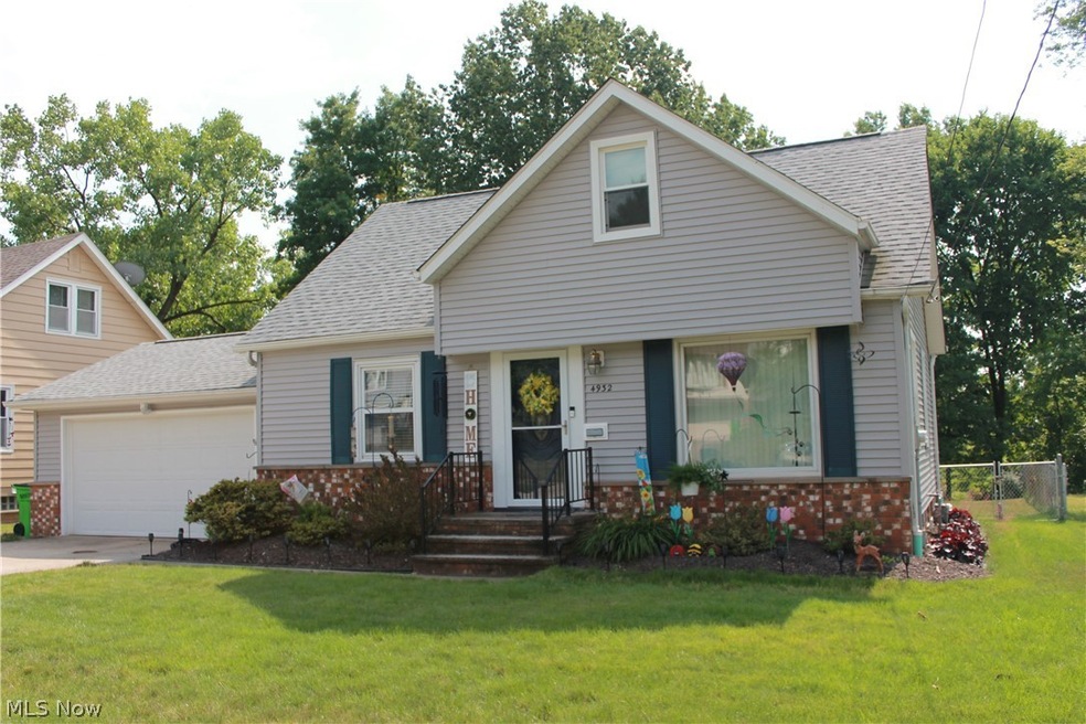 View of front of property featuring a 2 car attached garage with opener and a front yard