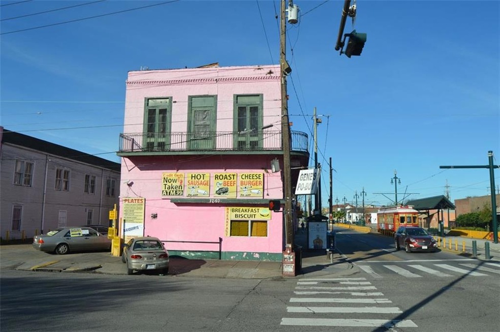 This great corner location at Elysian Fields and St. Claude has been operating as Gene’s PoBoys for approx. 50 years. Sale includes Building, Vacant Lot and Business (Gene’s PoBoys and Daiquiri Shop). Street Car service is now available via St. Claude! Front building is 2 stories with wrap around balcony, rear building is split level with outdoor patio on upper level. Very unique building and layout!