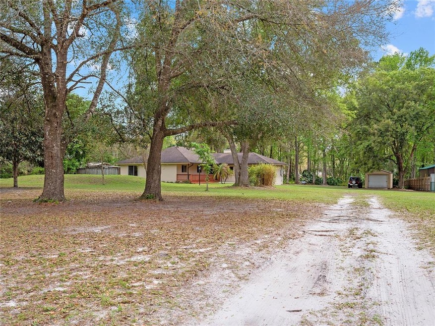 Country living in the heart of Lake Mary - 4 Bedrooms, 2 Bathrooms on 1.19 ACRES full of gorgeous MATURE TREES, zoned for TOP-RATED Lake Mary Schools, with a LOW HOA and ZONED for HORSES! 