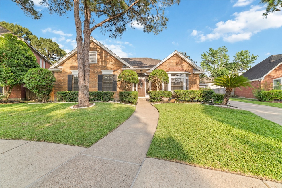 This inviting home features a charming brick exter
