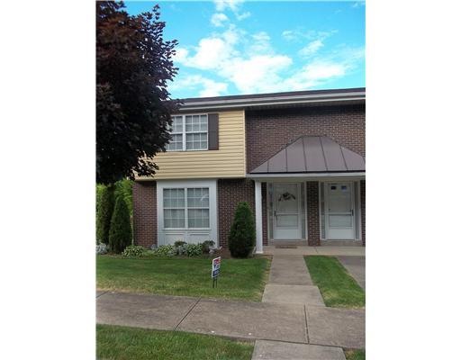 Exterior Front. Wonderful townhouse community.  Sidewalks, level entry, low monthly maintenace fee, and centrally located to main roads, shopping, and schools.  Large two bedroom, 1 1/2 baths, 2 car garage, large laundery room, deck in back, home war