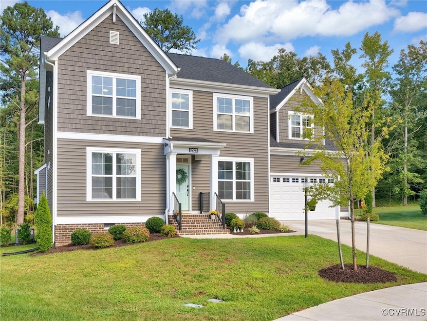 View of front facade featuring a garage and a fron