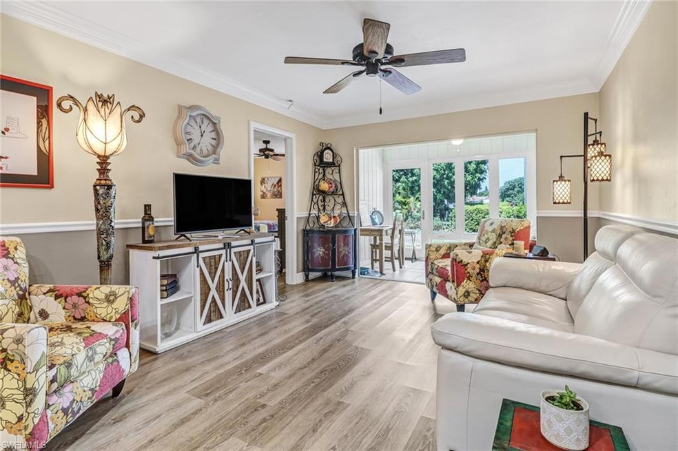 Living room with wood-type flooring, ornamental mo