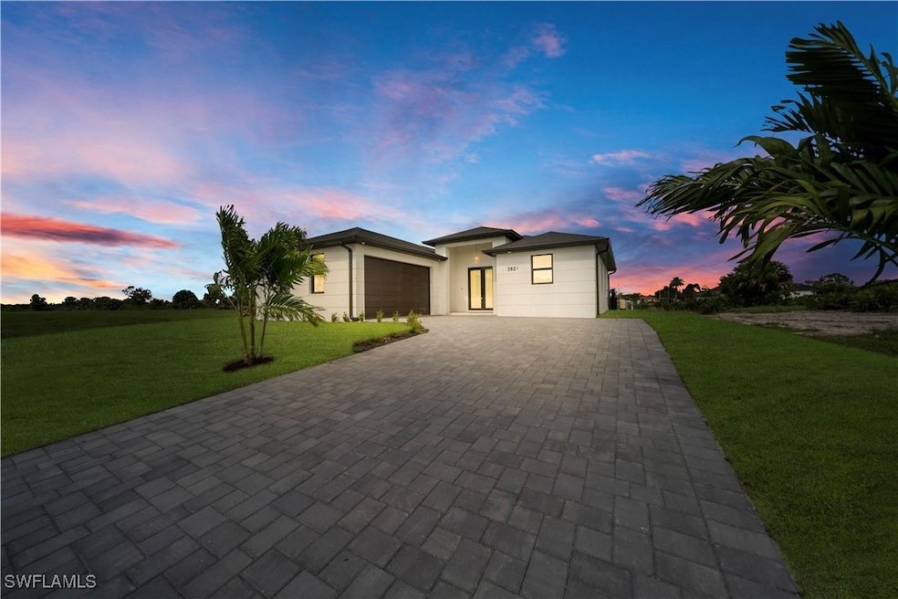 View of front of home featuring decorative drivewa