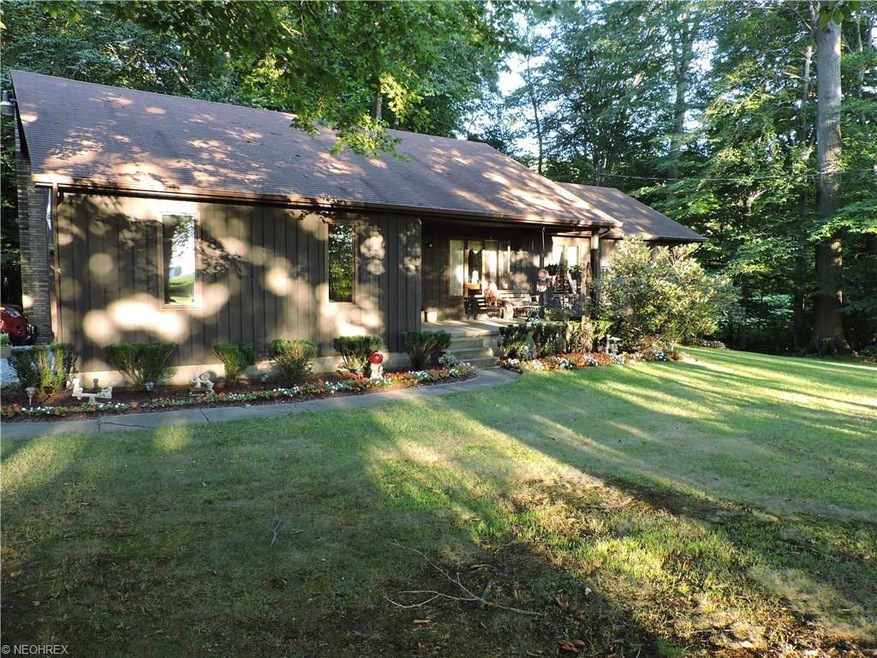 This Cedar sided home is sitting on a beautifully 