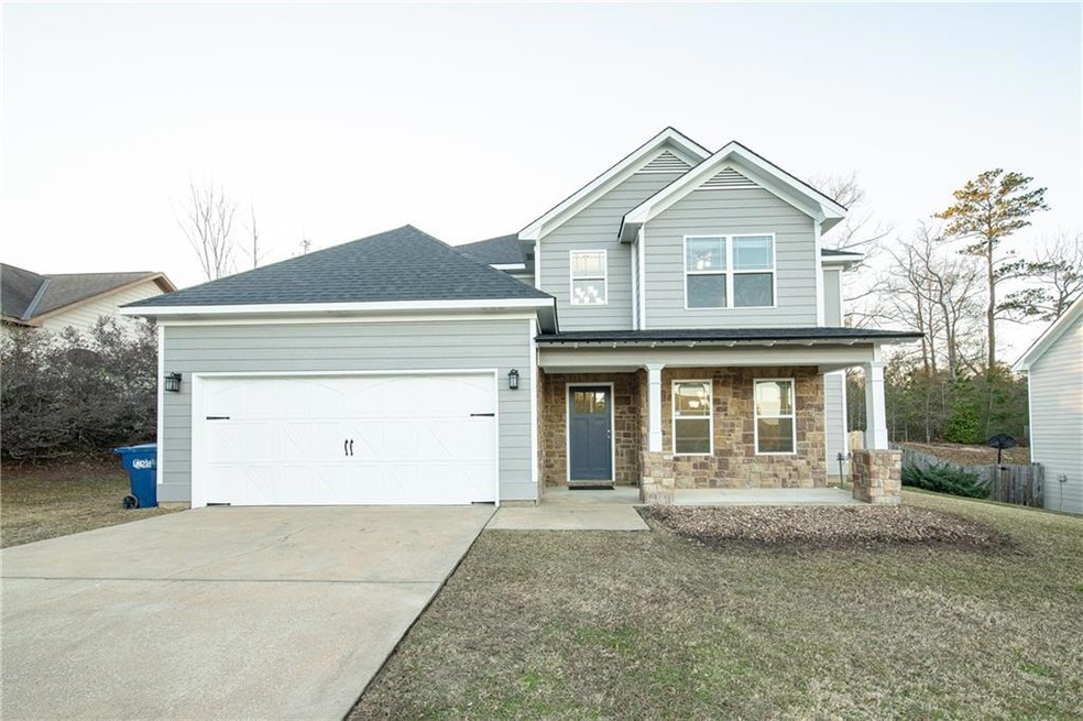 Craftsman-style home featuring covered porch and a