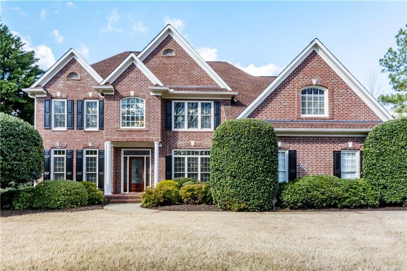 Gorgeous 3 sided brick home situated on a .84 acre