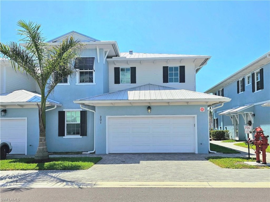 View of front of home with metal roof, stucco sidi