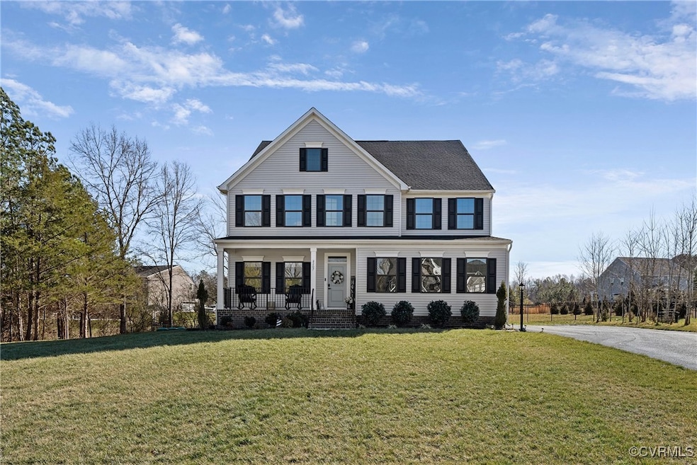 View of front facade featuring covered porch and a