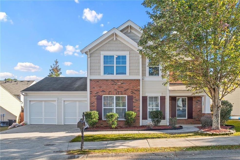 View of front of property with an attached garage,