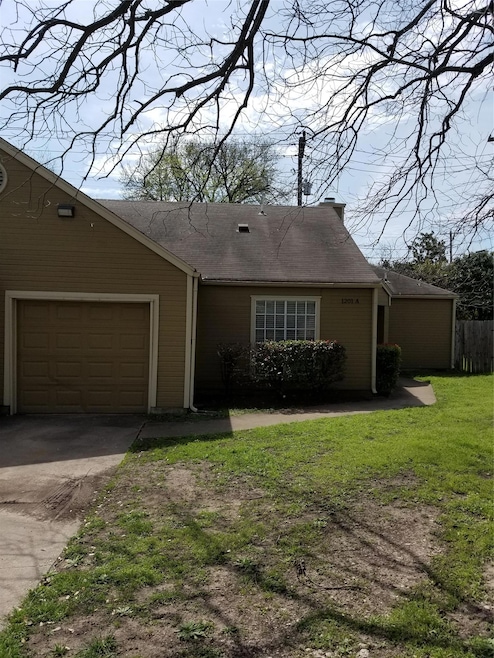 View of front of home featuring concrete driveway