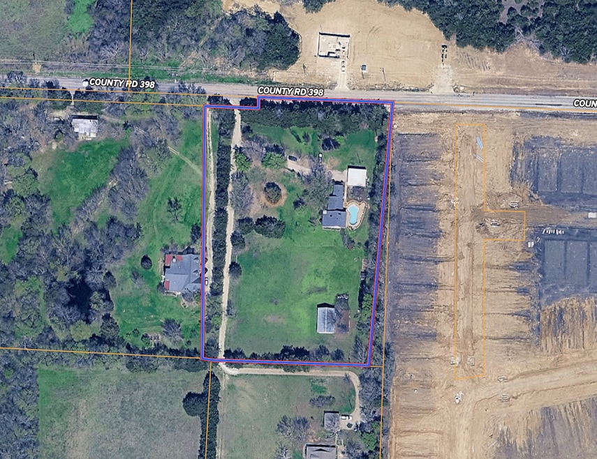 Aerial map of property and surrounding area featuring property parcel outlined