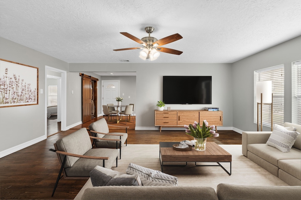 Upstairs unit living room/ Virtually staged.