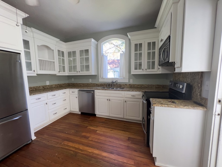 KITCHEN WITH BEAUTIFUL CABINETS AND GRANITE